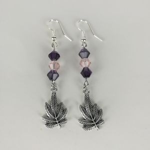 Simple cannabis leaf earrings made with pink and purple faceted glass beads